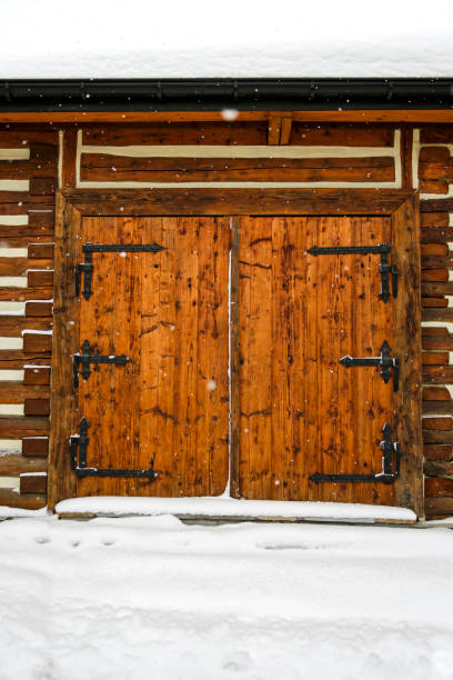 istock vintage wooden gate during a winter storm 1297253623