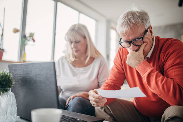 istock One senior couple calculating incoming bills 1297255344