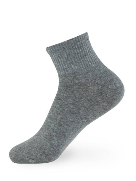 istock Isolated gray sock on invisible mannequin foot on white background, side view 1297255346