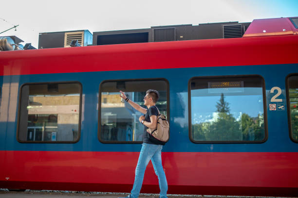 istock Man standing on the subway platform, waiting for his train 1297256702
