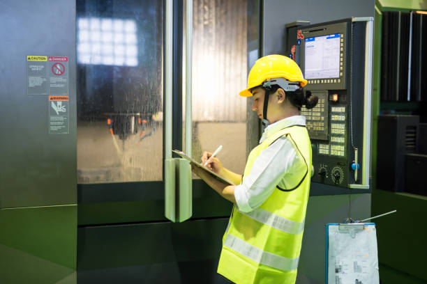 istock Inspector examine lathe milling machine in factory 1297256739