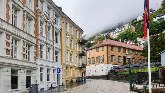 Bergen, Norway - May 5, 2019:A historic colorful residential area in the misty Norwegian Bergen