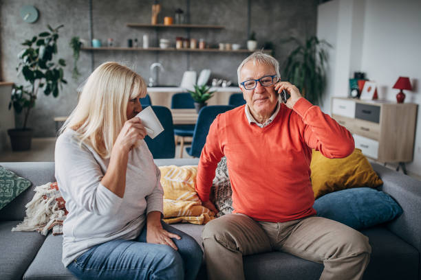 istock One senior man talking on the smart phone at home 1297260201
