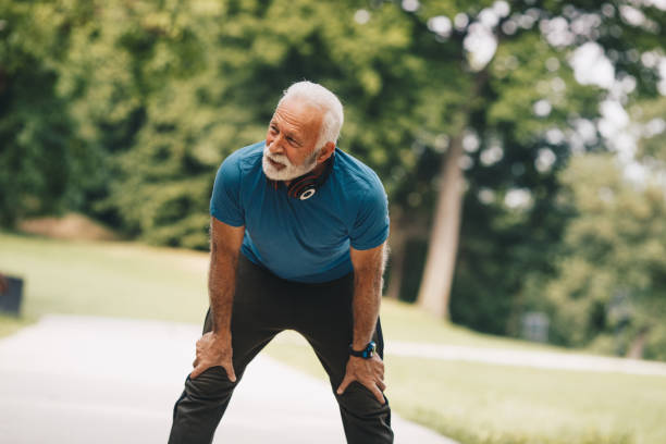 istock Senior man is resting after warming up exercises. 1297262400
