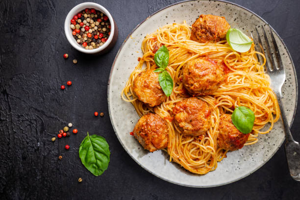 istock Plate of spaghetti with meatballs 1297264037