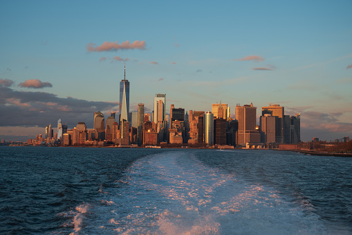 Manhattan, New York, USA - 1/18/2021 - Sunset over downtown Manhattan as seen from New York Harbor