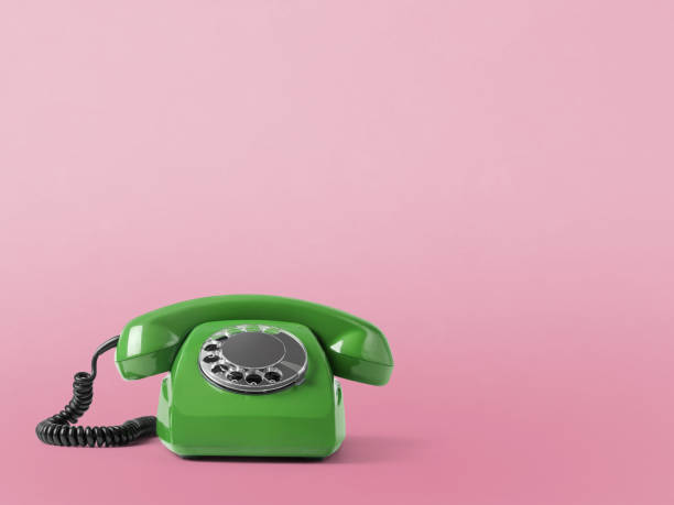 istock Vintage telephone on pink background 1297265231