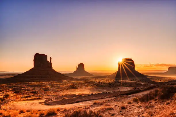 Photo of Monument Valley in Navajo National Park at Sunrise, Border of Utah and Arizona, USA