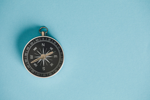 Compass on the blue background.