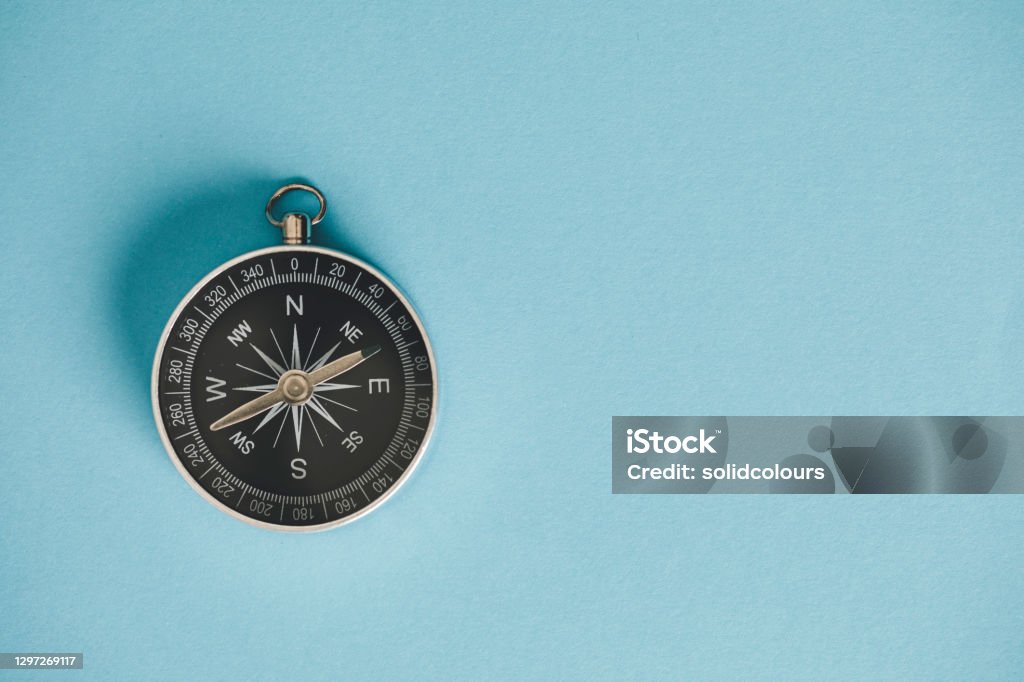 Compass Compass on the blue background. Navigational Compass Stock Photo