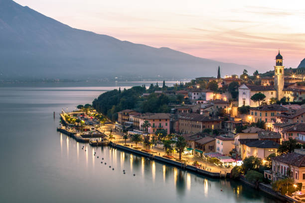 Limone on Garda lake reflection during magic sunset, Brescia, Italy