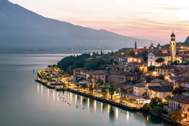 Scenic view of italian village after sunset at blue hour on Garda lake, Garda See, Limone, Brescia, Italy