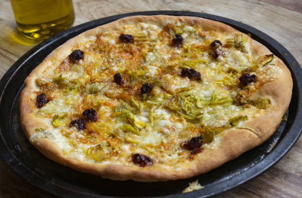 istock pizza with nduja and zucchini flowers 1297272755