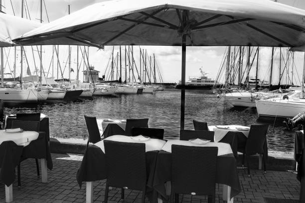 istock Rome port view through the tables of a restaurant 1297272805