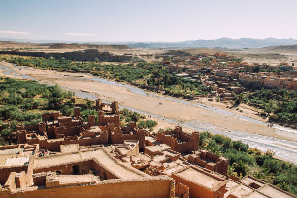 istock Ait Benhaddou berber kasbah and palm tree oasis, Morocco 1297272975