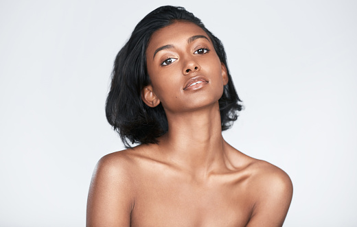 Beauty young Afro American woman in pink dress.