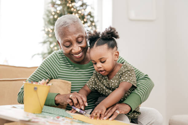 istock Granddaughter colouring with grandmother 1297274219