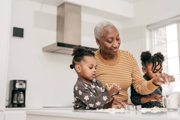 istock Learning from grandmother how to bake and have fun 1297274266