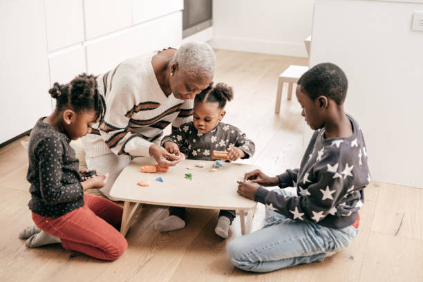 istock Grandmother playing with with grandkids 1297274355