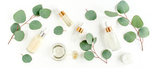 istock Eucalyptus essential oil, eucalyptus leaves on white background. Natural, Organic cosmetics products. Medicinal, Natural Serums. Flat lay, top view 1297274573