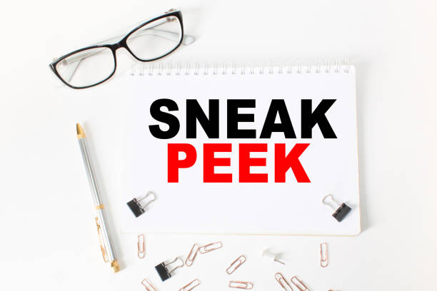istock Notepad with inscriptions SNEAK PEEK on a white background. business concept. 1297275534