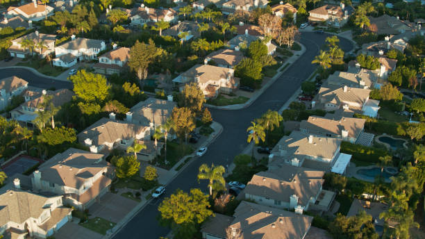 istock Tranquil Residential Street in Northridge, CA at Sunset - Aerial 1297277119