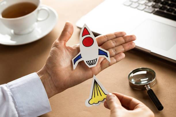 Business Person with Startup Rocket