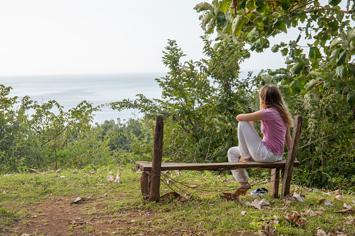 She looks out towards Pacific Ocean in the distance