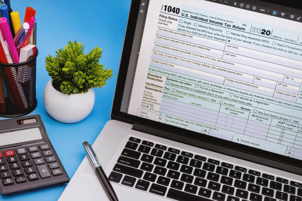 Tax Form 1040 on Laptop Screen. stock photo