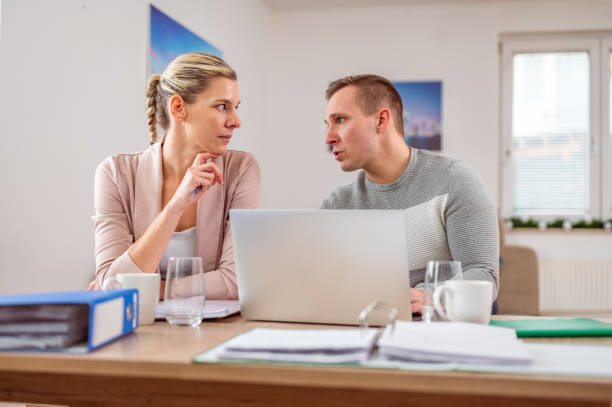 istock Young adult couple working from home 1297280150