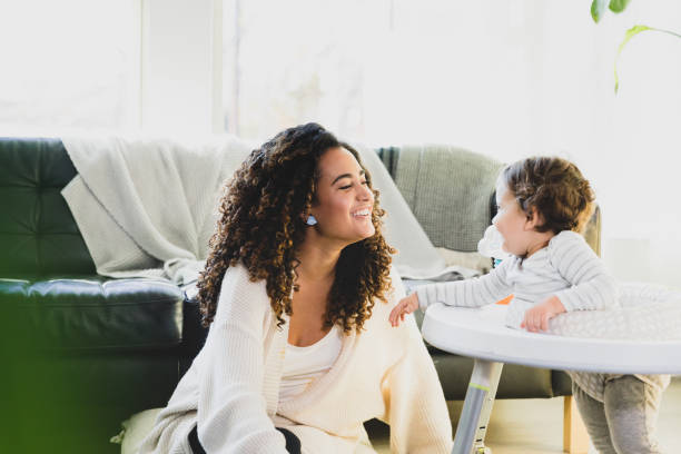istock New mom plays with her baby 1297281473