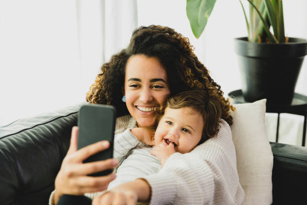 istock Mom and son video chat with family 1297281479