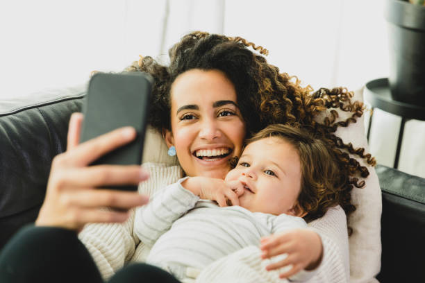 istock Happy mom relaxes with son 1297281483