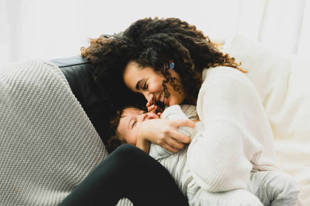 istock New mom snuggles with her baby boy 1297281490