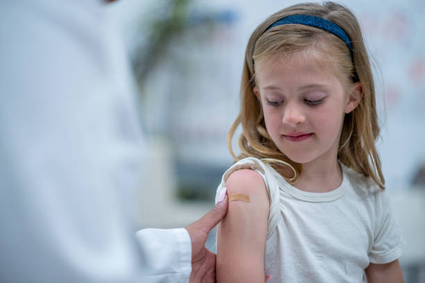 istock A band aid to cover the injection! 1297281592