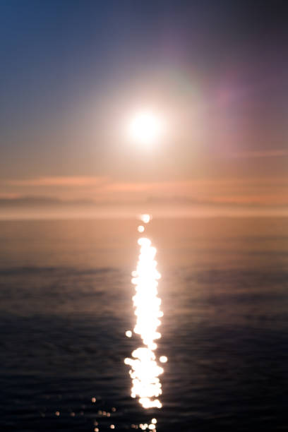istock Abstract view of the sun setting over Puget Sound 1297283503
