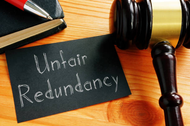 istock Unfair redundancy is shown on the conceptual photo using the text 1297285905