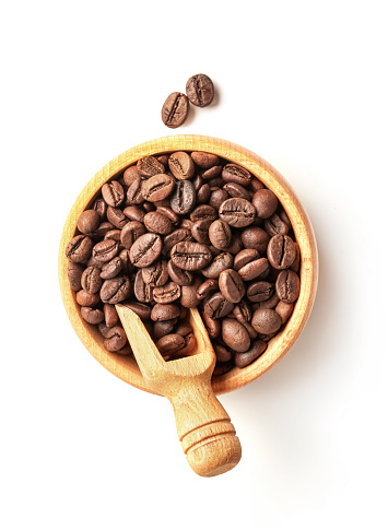 Fresh coffee beans in a wooden bowl  isolated on white background