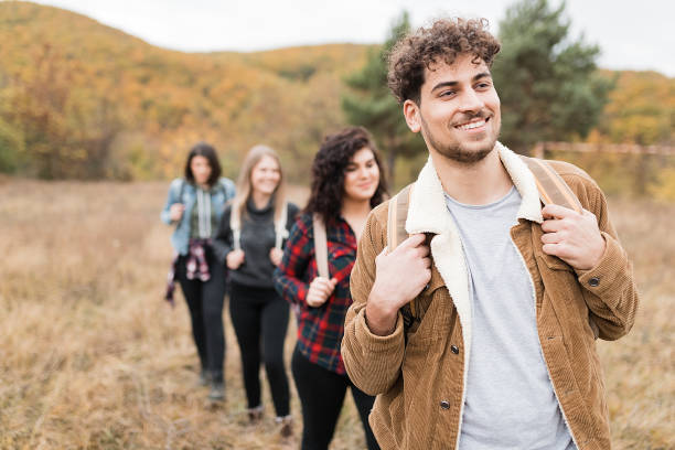 istock Happy young friends on hiking trip 1297286409