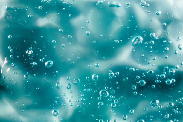 istock Liquid cream gel, green blue cosmetic texture with bubbles 1297287858