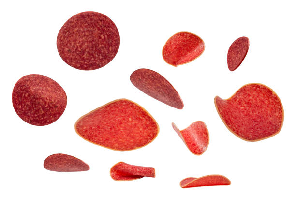 istock Falling salami isolated on white background. 1297288798