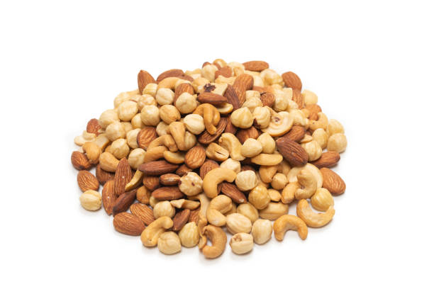 istock Mix of nuts isolated on white background. Top view. 1297288858