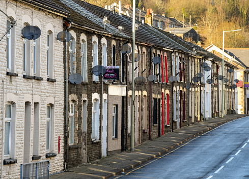 Rhondda, Wales - January 2018: Row of terraced houses on a road. This style of housing is common in the South Wales valleys