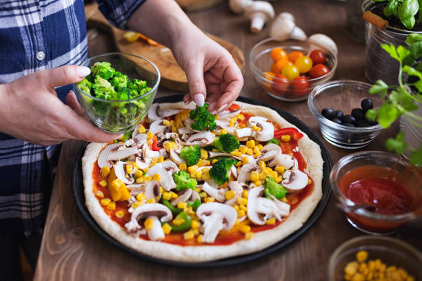 istock Making a Vegetarian Pizza at Home 1297289789