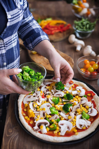 istock Making a Vegetarian Pizza at Home 1297290433