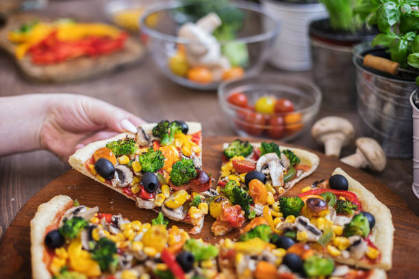 istock Vegetarian Pizza with Broccoli, Cherry Tomato, Pepper and Mushrooms 1297290570