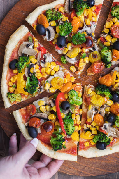 istock Vegetarian Pizza with Broccoli, Cherry Tomato, Pepper and Mushrooms 1297290603
