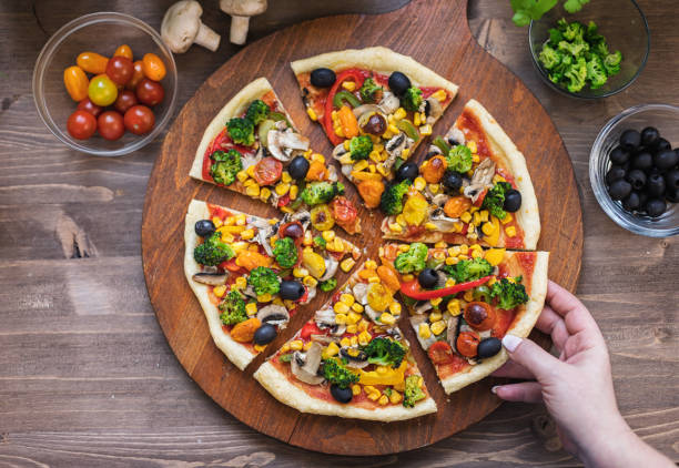 istock Vegetarian Pizza with Broccoli, Cherry Tomato, Pepper and Mushrooms 1297290721