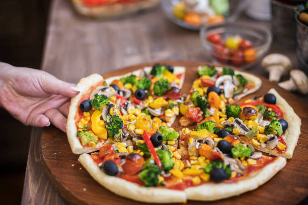 istock Vegetarian Pizza with Broccoli, Cherry Tomato, Pepper and Mushrooms 1297290723