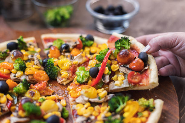 istock Vegetarian Pizza with Broccoli, Cherry Tomato, Pepper and Mushrooms 1297290755